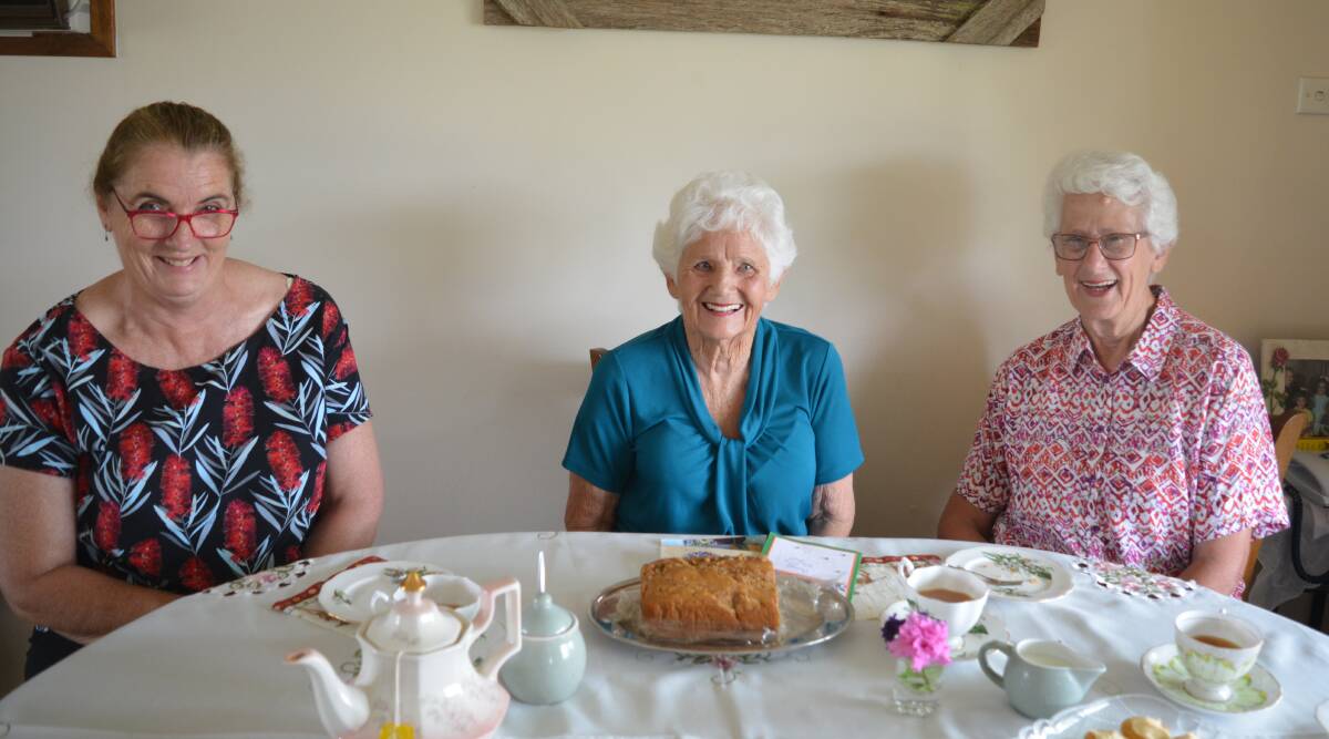 Dot Stokes, Elaine Maslen and Leonie Benson enjoy a cuppa, a slice of cake and a chat. Photo Anne Keen