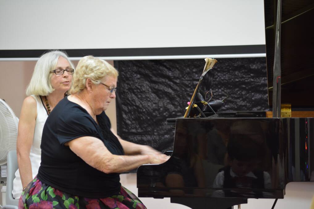 Helen Evans performing at the year end concert with Annette Burrows watching on. Photo Anne Keen