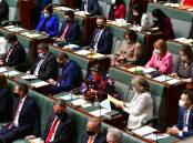 Labor MPs all masked up on the first sitting day. Picture: Elesa Kurtz