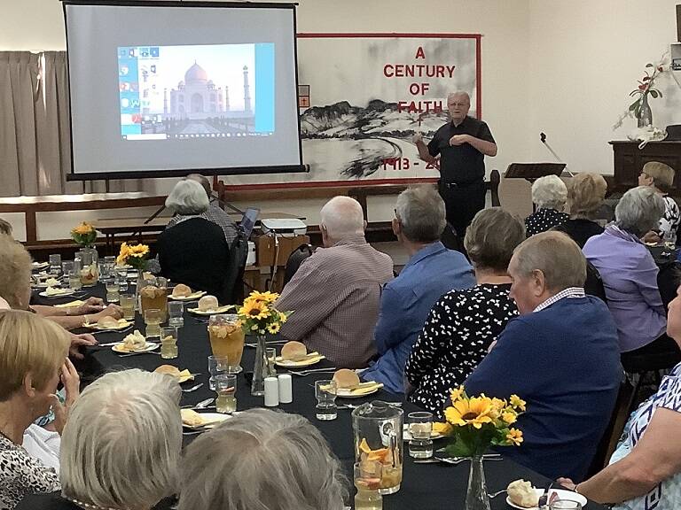 Reverend Bill Crews keeps the audience captivated at a dinner 