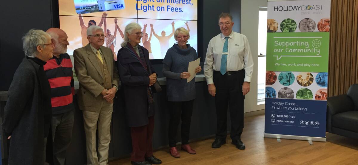 GEG members Pippa Robinson, Steve Robinson, Robert Mendham, Penny Drake-Brokman, Di Montague gratefully receive a grant from chief executive of HCCU Neville Parsons.
