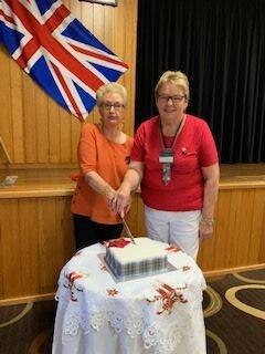 Celebration: Judy Hemmingway and Joan Harwood cut the Gloucester VIEW Club Christmas cake.