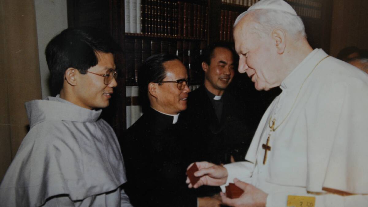 Young: A young Catholic priest Vincent Long Van Nguyen meets Pope John Paul II in 1992. In February, 2017 Bishop Long criticised the clericalism of Pope John Paul II and Pope Benedict's periods as heads of the Catholic church.