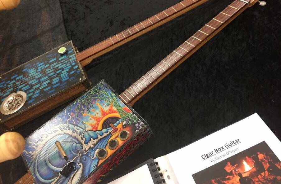 Three-stringed cigar box guitars with tuning pegs were made by Samuel O'Bryan of Taree High School and were at the display in 2016.