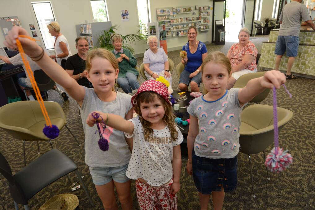 Ayla Stevens, Olive Ward and Ave Prigg enjoyed a pom pom making class at Harrington Library's 'craft Tuesday'.