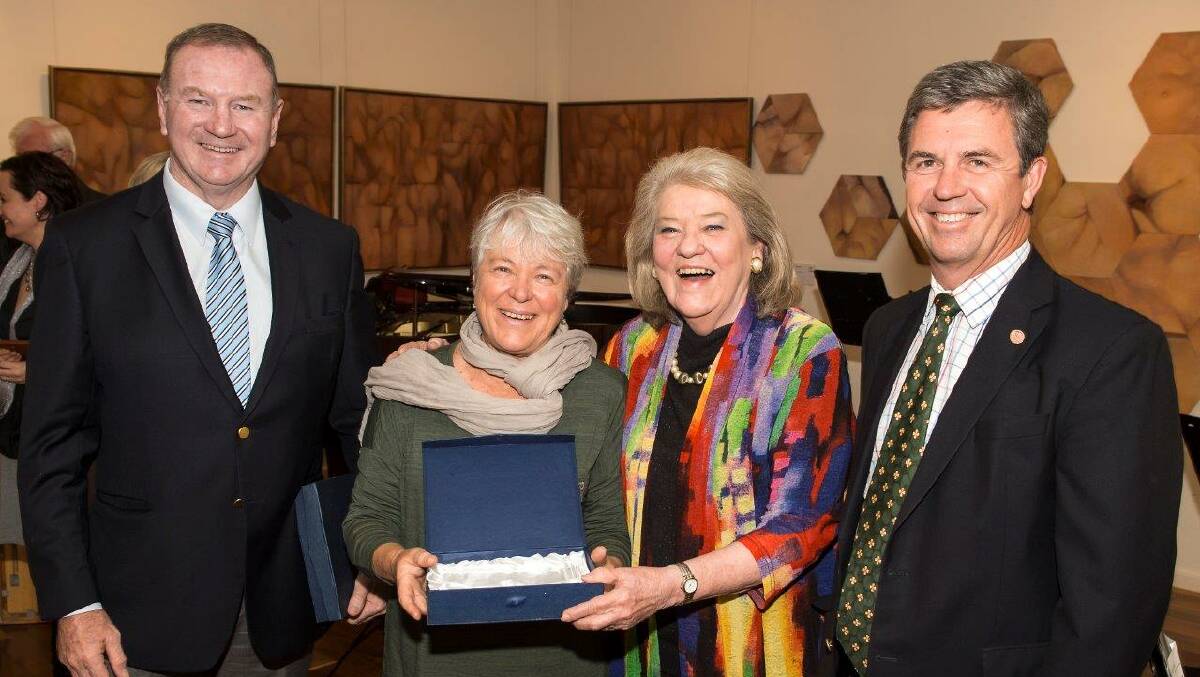 Julie Slavin receiving the 2016 Visual Arts Award from Manning Winter Festival president Mave Richardson, with Member for Myall Lakes Stephen Bromhead and Member for Lyne Dr David Gillespie. Photo: submitted