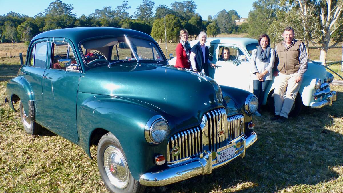 Killabakh’s ‘A Day in the Country’ committee members Michelle Swannack, Judith Jackson, Anna Axisa and George Hoad admiring Jim Hull’s (seated) prized vintage Holden cars to be displayed on Saturday, September 1.