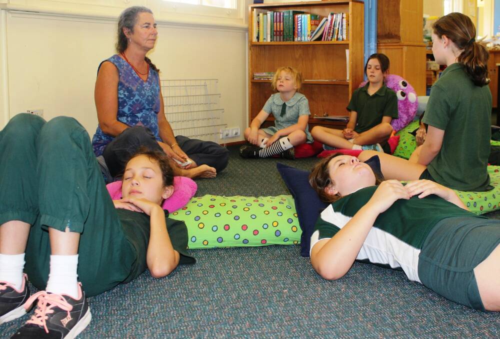 Meditation session: Sharn Rocco with students of Nowendoc Public School during one of their weekly mindfulness lessons. Picture: supplied