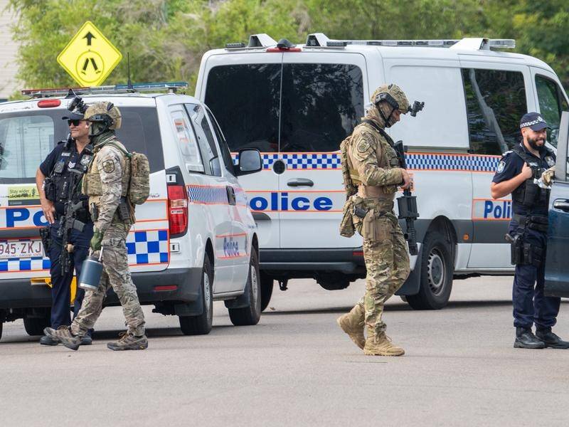 A man has been arrested a week after allegedly holding police at bay at a Townsville home.