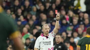 Wayne Barnes upgrades the yellow card for Sam Cane (not pictured) to red after TMO Tom Foley ruled. (AP PHOTO)