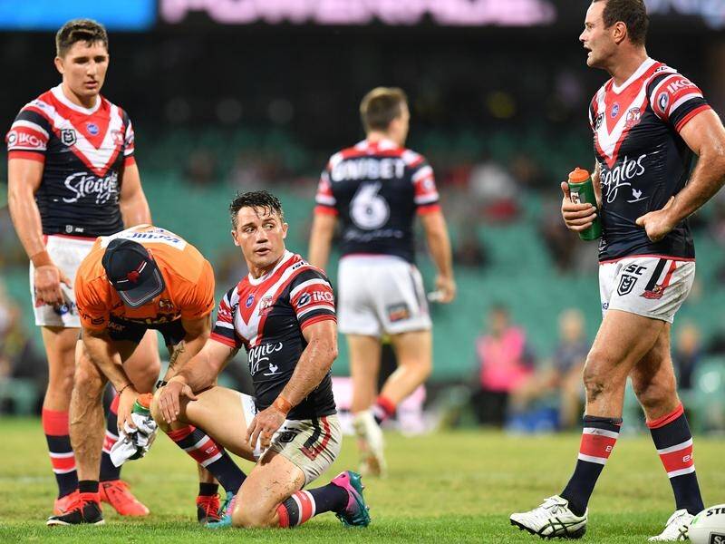 Cooper Cronk is treated after his late hit by Bronco Tevita Pangai Junior.