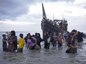 A boat of Rohingya people landed on a beach in Indonesia's Aceh province last week. (AP PHOTO)