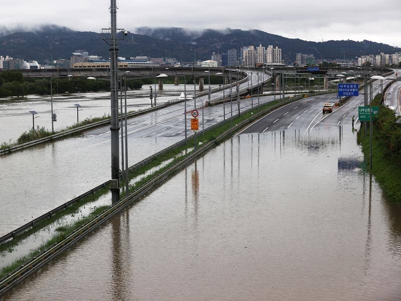 Widespread flooding in South Korea has claimed at least 16 lives.