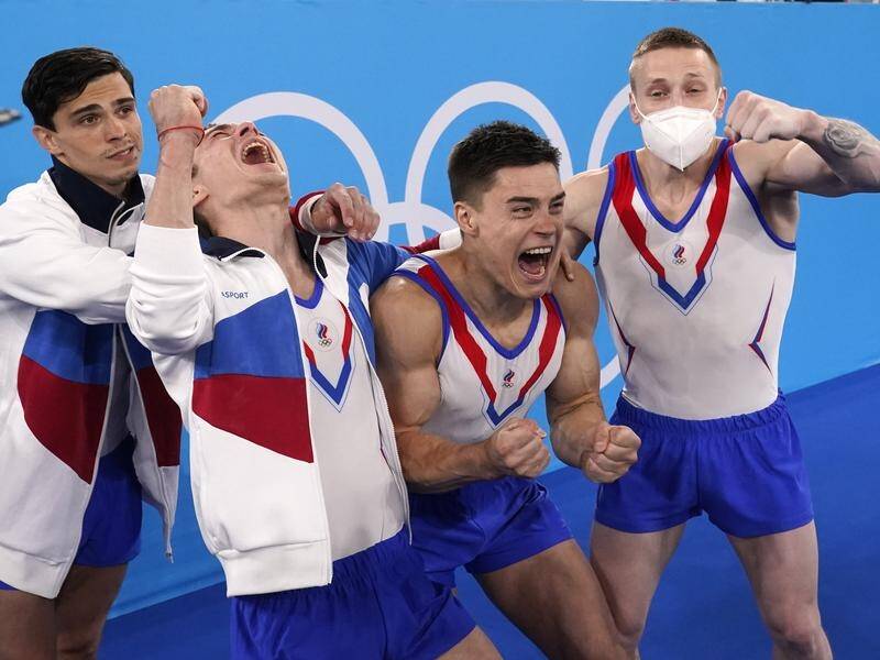 Russia's gymnastics men's team hail Artur Dalaloyan (left) as a hero for helping them win team gold.