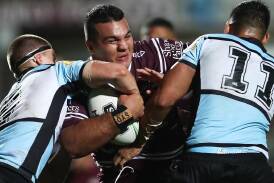 Former Manly player Lloyd Perrett (c) is threatening to take the club to the Supreme Court. (Brendon Thorne/AAP PHOTOS)