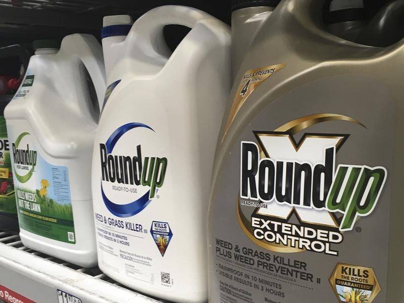 A US judge says Monsanto "deserves to be punished" but has reduced a payout by more than $US50m.