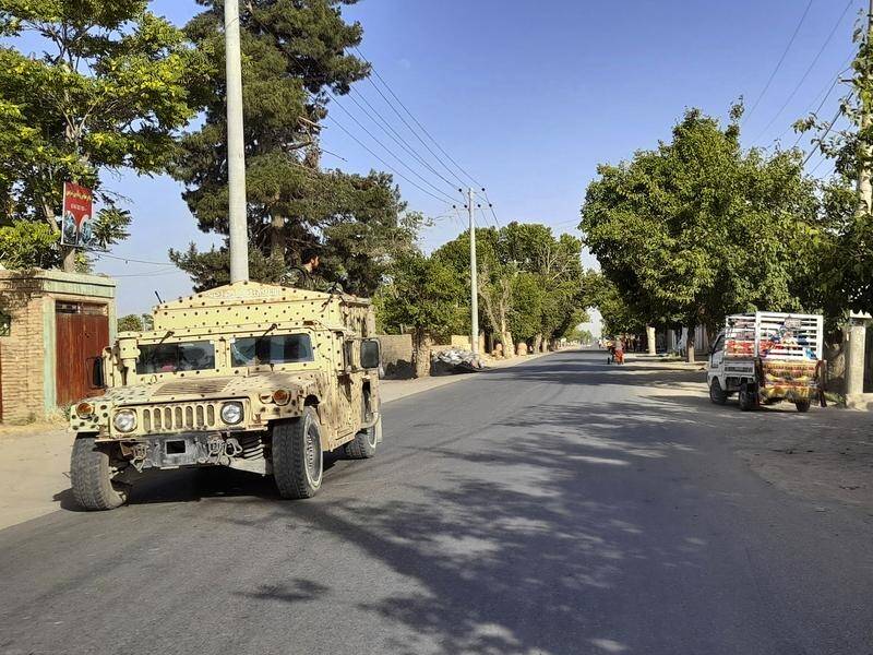 An Afghan army vehicle patrols the Taliban-encircled northern city of Kunduz.