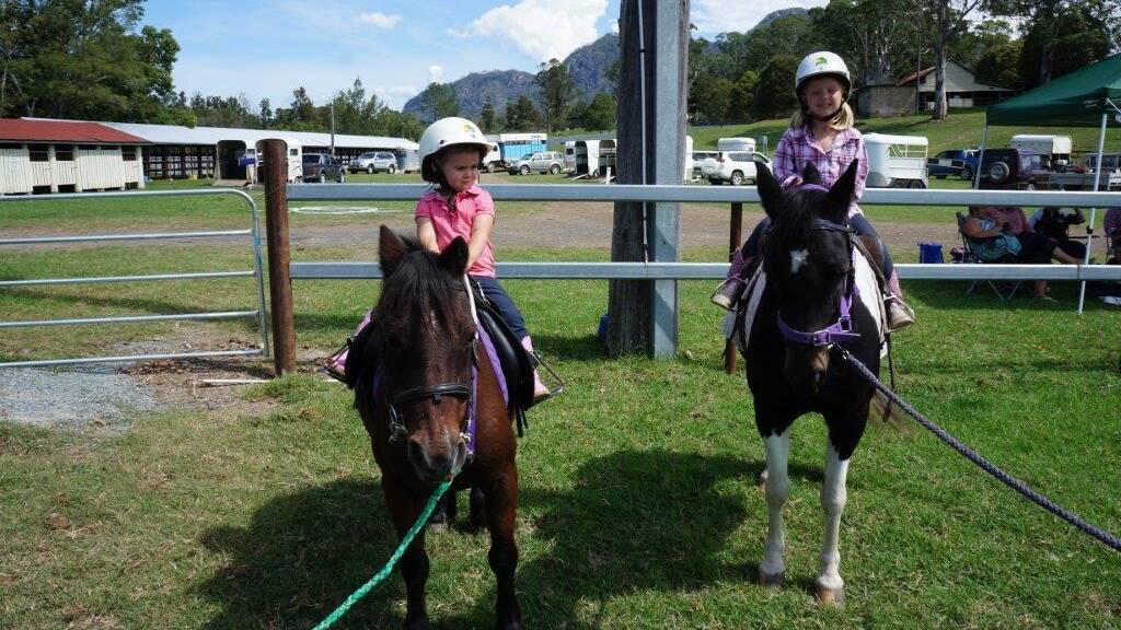 Pony club members Chloe Campbell, 2, and Melody Maslen, 4.