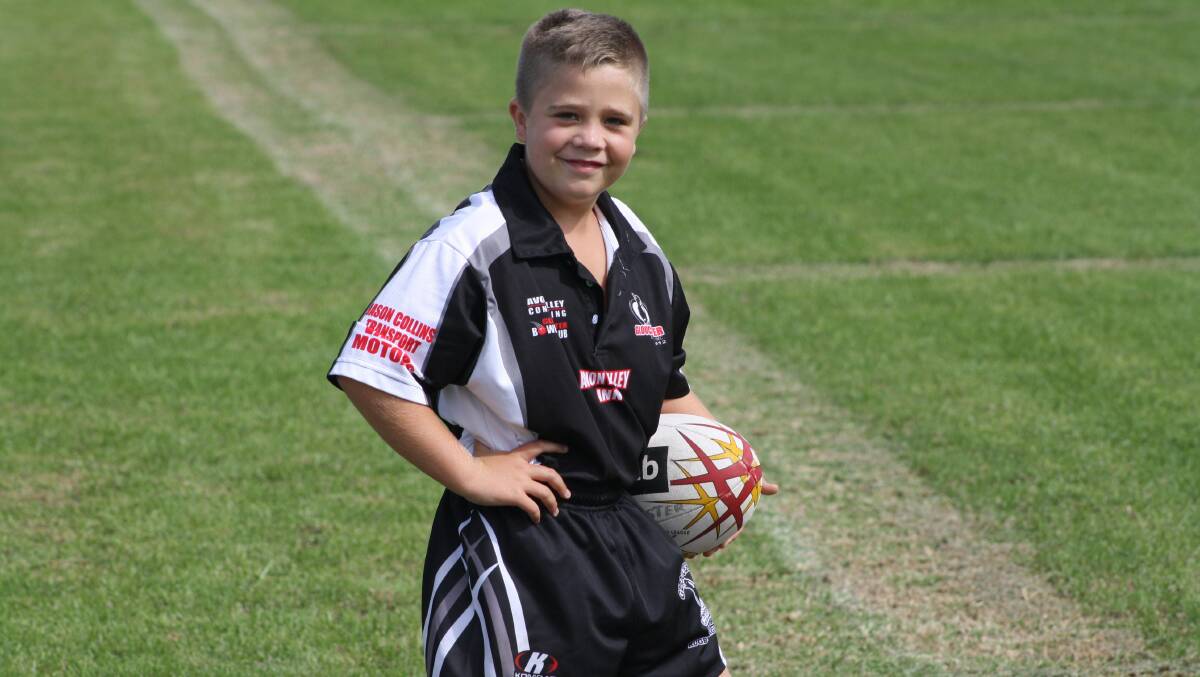 Ball boy Lucas Summerville before the start of Saturday's game against the Karuah Roos.