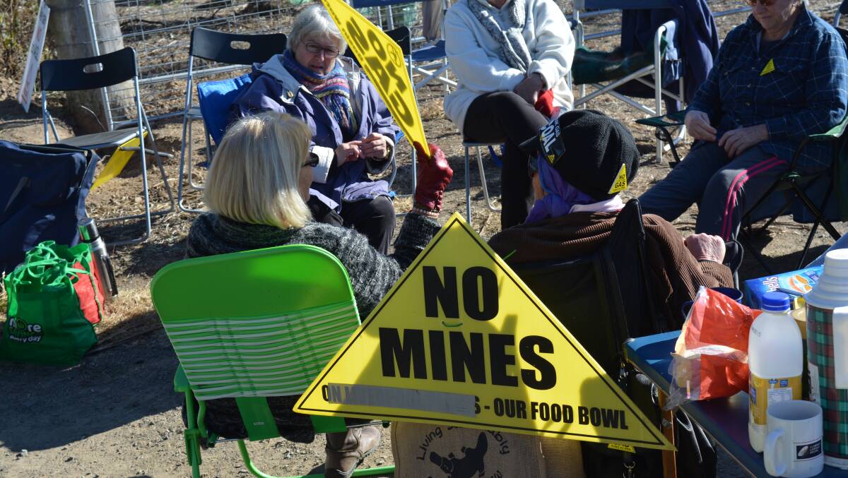 Protesters gather outside one of AGL's well sites on Fairbairns Lane.