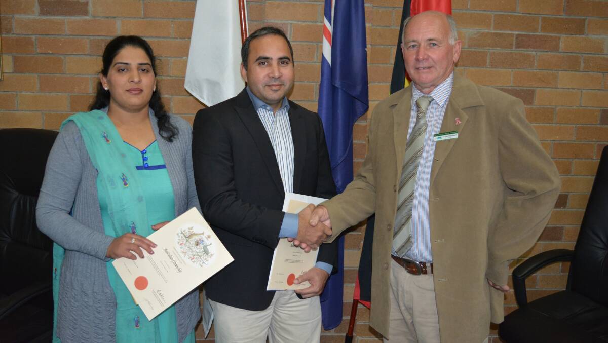 Dr Safwat Khalid and wife Jazilo with mayor John Rosenbaum after becoming Australian citizens.