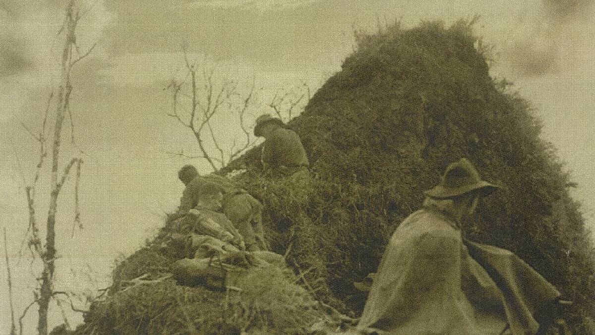  Soldiers on lookout atop Shaggy Ridge during the Second World War.