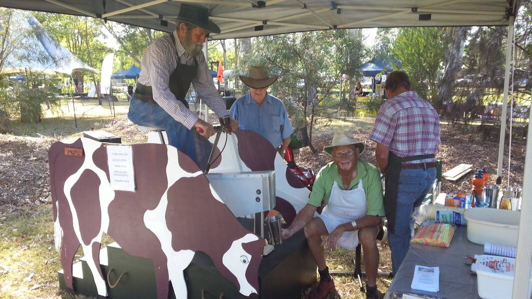 Members of the Gloucester Men’s Shed try out the pedal-powered milkshake maker at last year’s festival.