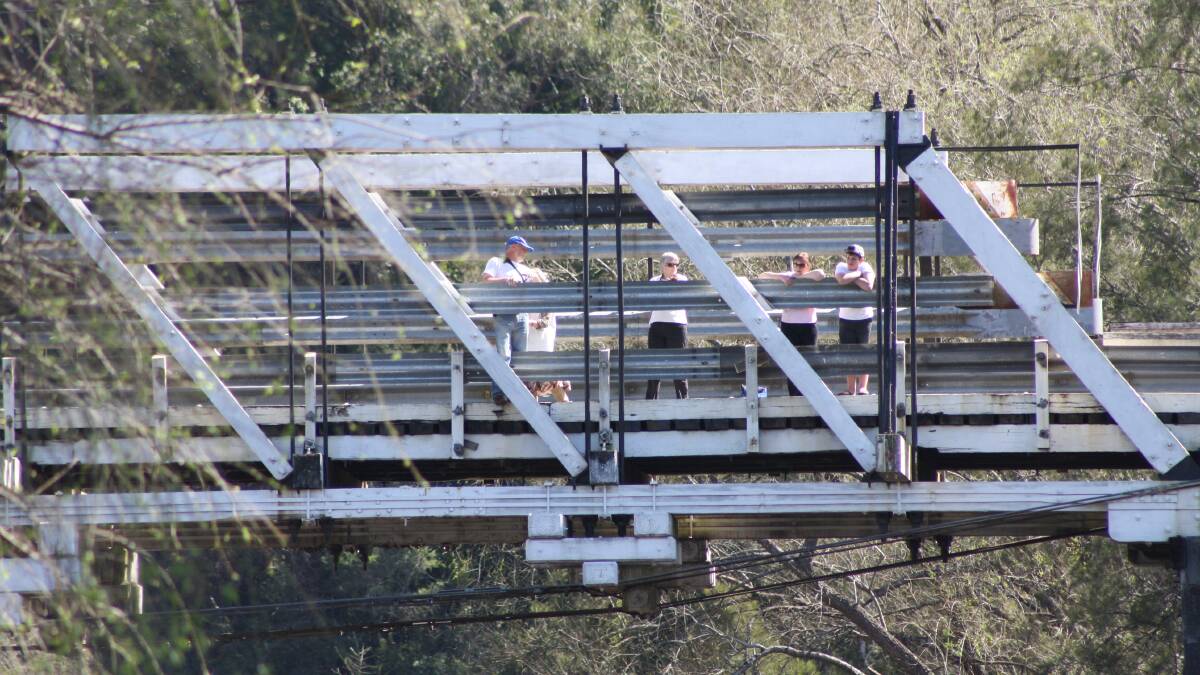 Spectators line the Barrington Bridge for the Gloucester Mountain Man Tri Challenge.
