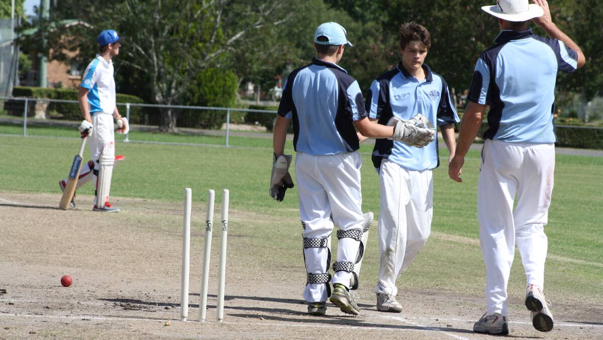 Coen Durbidge and James Yates celebrate a wicket for Cavs.