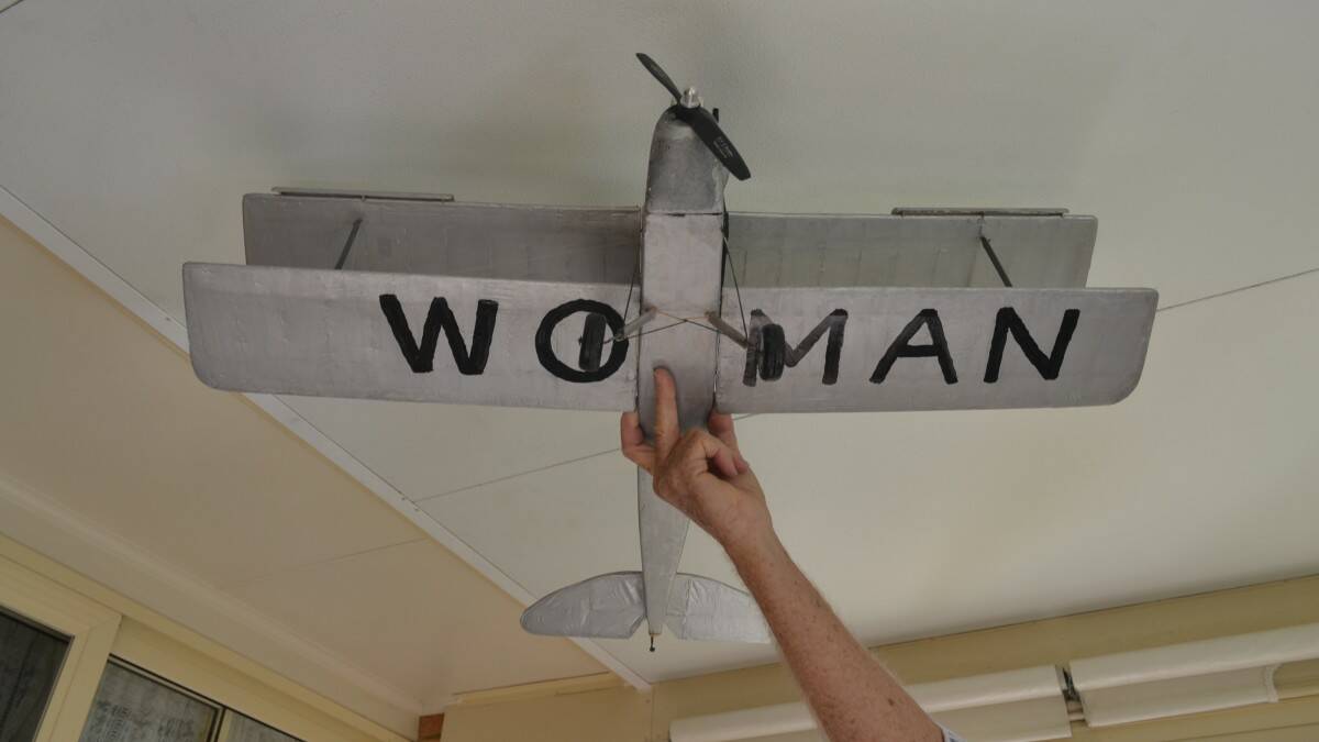 True to the original, Bob Craine has painted the word "WOMAN" under his replica Gipsy Moth.