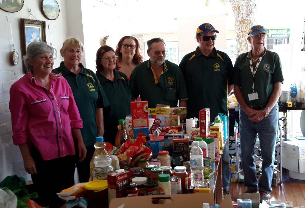 Members of Lions Club of Gloucester and volunteers with June's Place owner, Vicki Harris during the Need for Feed campaign in 2018.