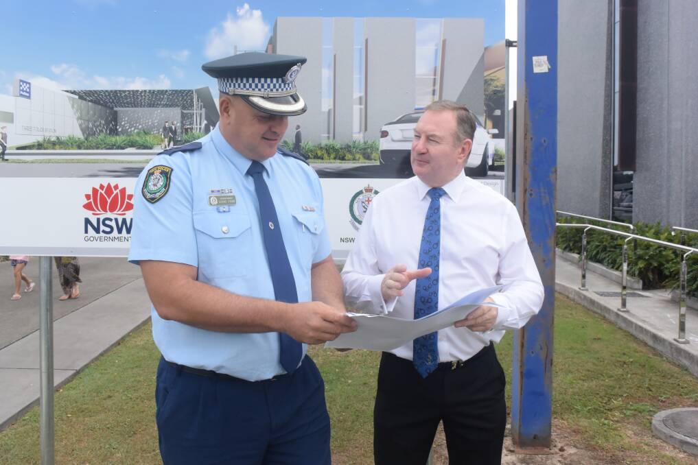 Approval: Detective superintendent Shane Cribb inspects the plans with Member for Myall Lakes Stephen Bromhead. Photo: Rob Douglas. 