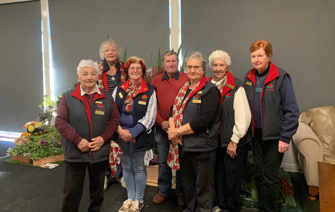 Effie Crawley (third from right) received life membership to NSW Floral Art Association. She is pictured with members of the Gloucester Floral Art Group.