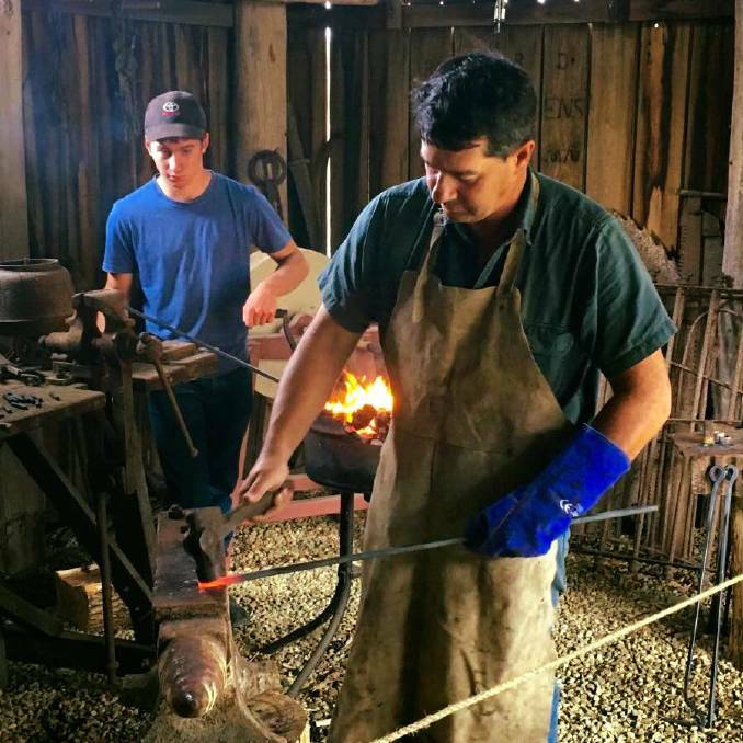 Rodney and Bailey Gorton demonstrate the blacksmiths forge as part of a Locals Day.