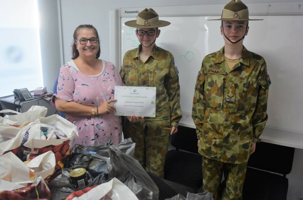 Suzi Rowe presented a certificate to Sarah McDonald cadet CSM and Andre McKay cadet LCPL.