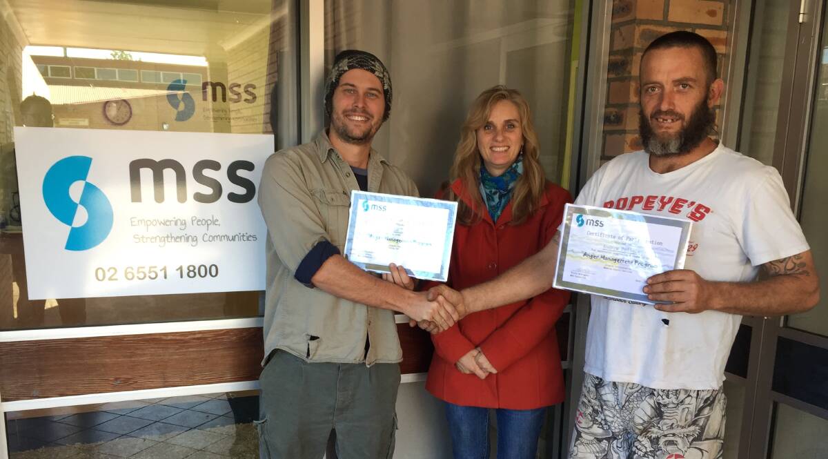 Supporting each other: Gloucester Anger Management Group graduates Adam Godwin and Andrew Pollock with Manning Support Services counsellor Patricia McDougall. Photo: Rob Douglas.