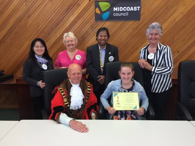 MidCoast Council Mayor David West, essay competition winner Poppy Yates and Gloucester Rotary judges.