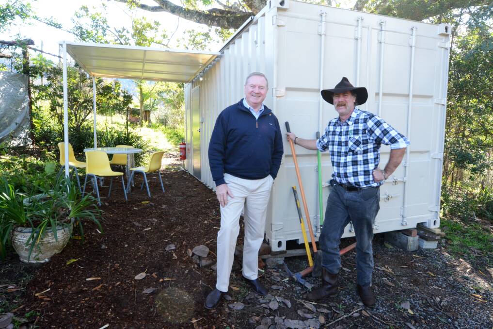 Paul (right) with Member for Myall Lakes Stephen Bromhead after a temporary housing pod was delivered to his Bobin property last week. Photo: Scott Calvin.