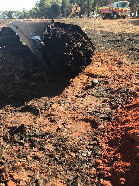 The base of an Essential Energy power pole following a stubble burn incident on a property in regional NSW.