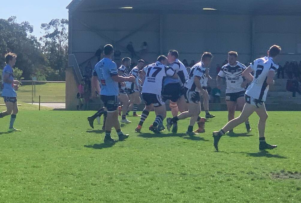 Sudden death: Magpies defenders swamp a Tall Timbers player during their grand final qualifier. Photo: Donna Summerville.