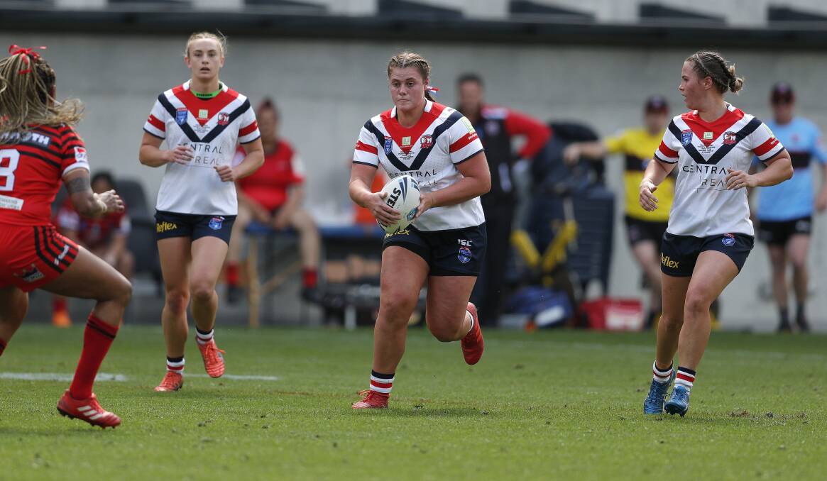 On the charge: Gloucester's Tayla Predebon sizes up the North Sydney defence in the women's premiership grand final. Photo: Bryden Sharp.
