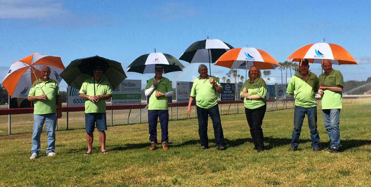 Praying for rain: Tuncurry Forster Jockey Club's Garry Chalmers, Phil Glendenning, Bill Fanning, Garry McQuillan, Julie Manning, Ray Glover and Adrian Wood encourage farmers to take up their offer. 