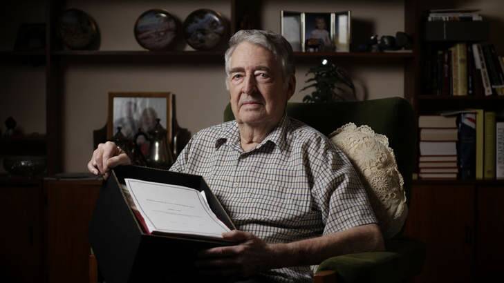 Maralinga nuclear testing veteran Alan Batchelor with a box of evidence related to the case.