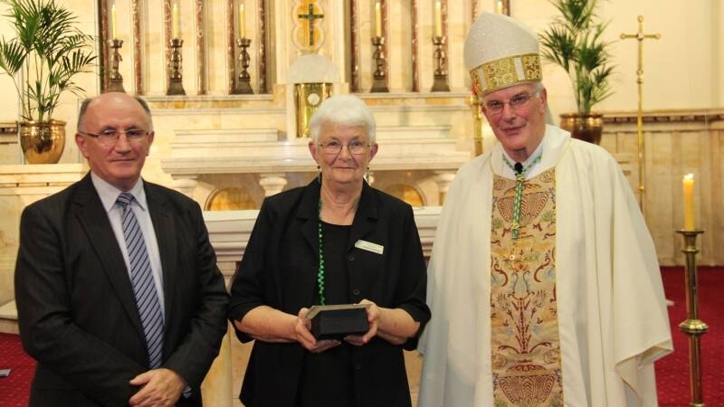 Barbara Mansfield with Bishop Bill Wright and the director of Catholic schools in the diocese Ray Collins at the awards night in Newcastle last Tuesday.