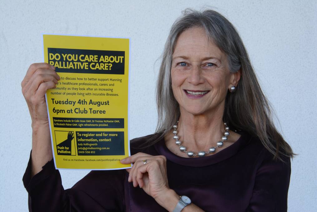 Judy, a certified palliative care volunteer with the local district of Hunter New England Health, holds the poster for the palliative care meeting on Tuesday, August 4 at Club Taree.